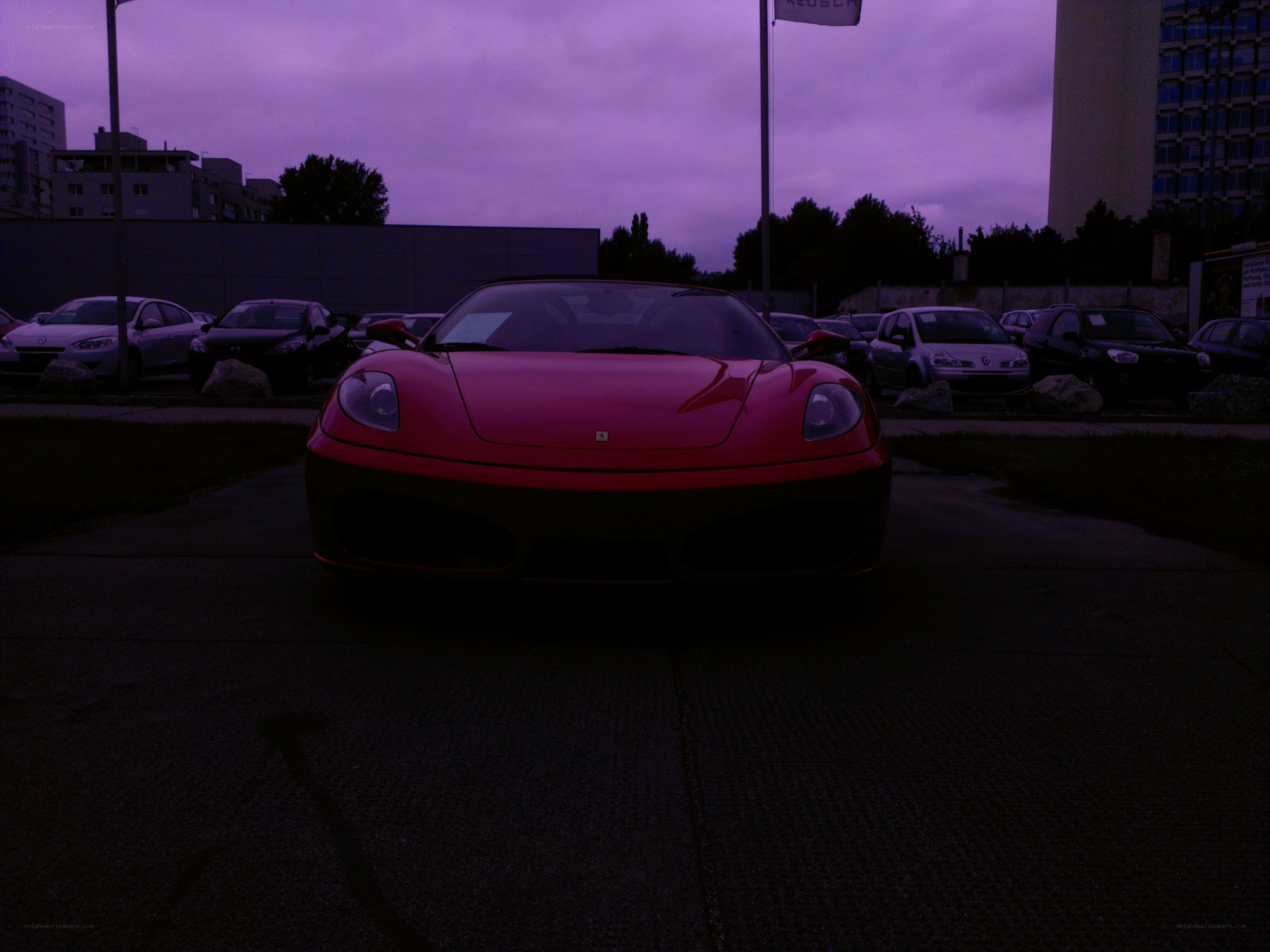 Red Ferrari at dusk