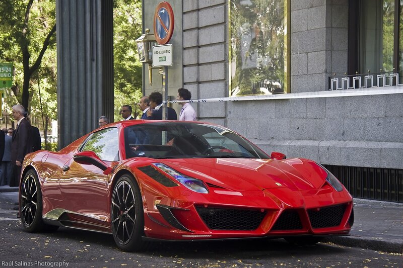 Red Ferrari at hotel entrance