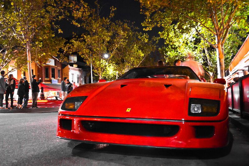 Red Ferrari at night in city