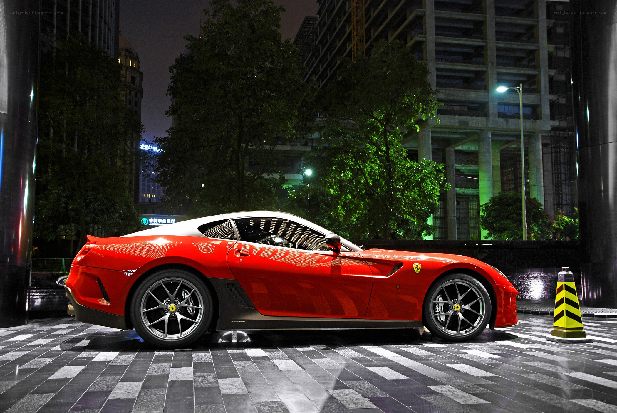 Red Ferrari at night in city