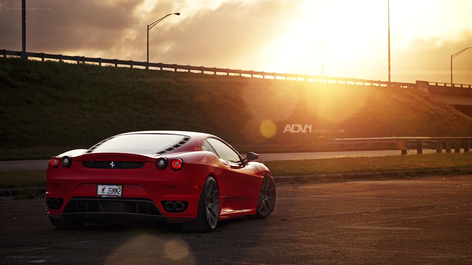 Red Ferrari at sunset