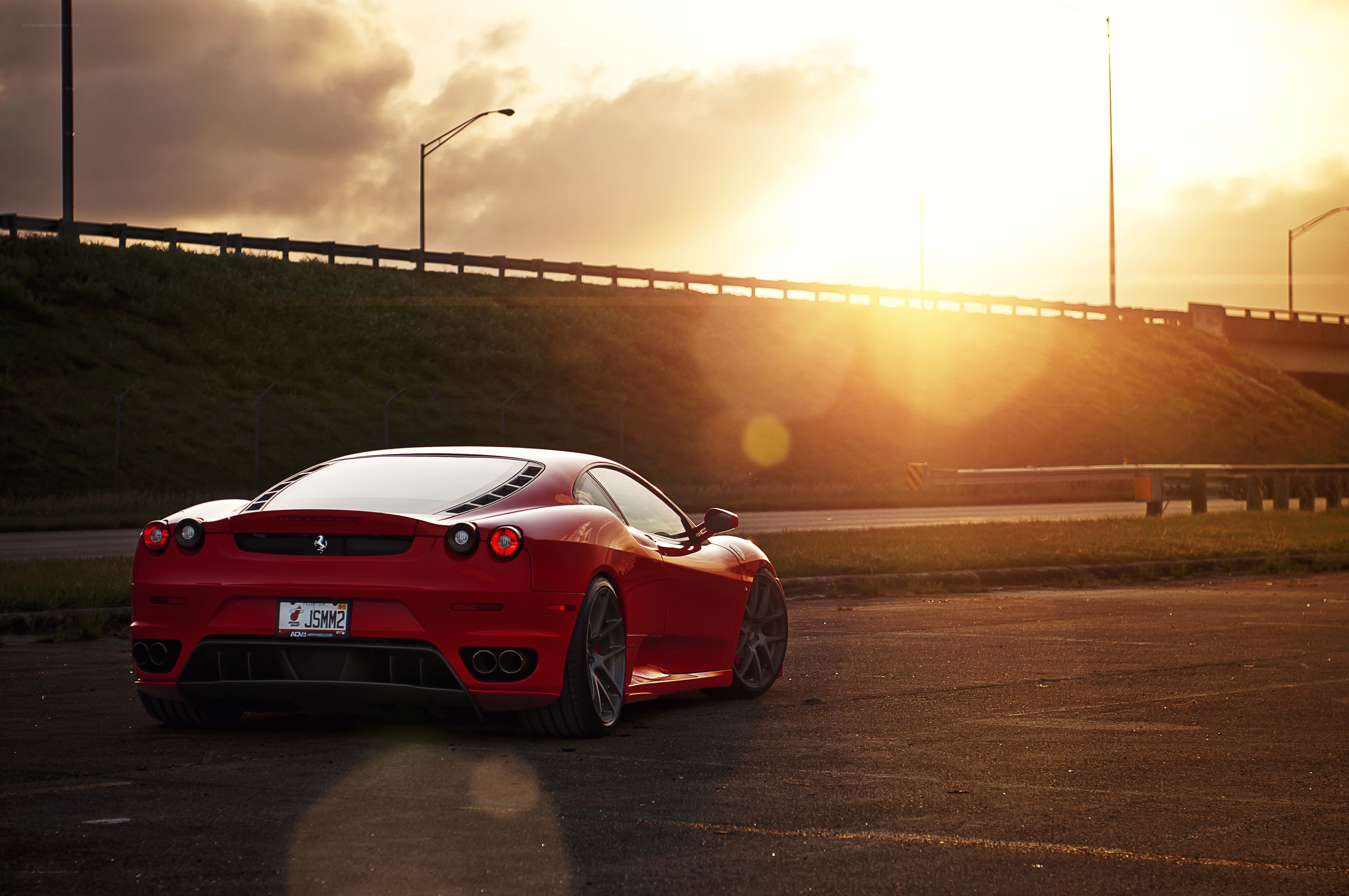 Red Ferrari at sunset