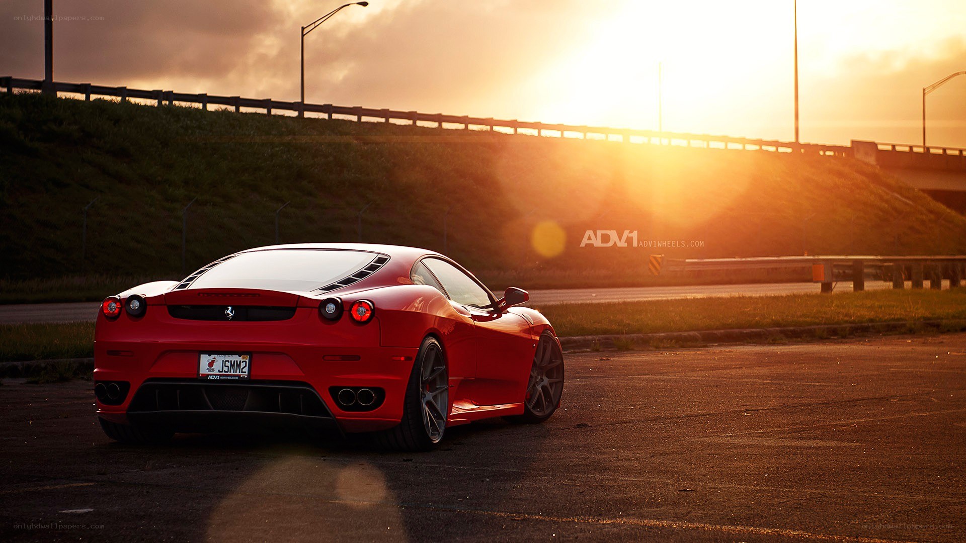 Red Ferrari at sunset