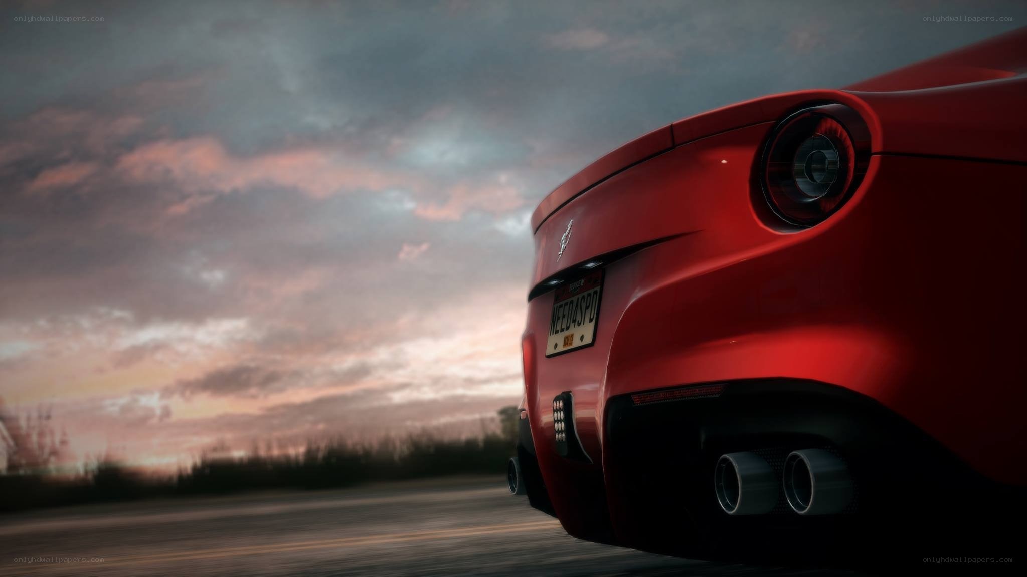 red ferrari at sunset