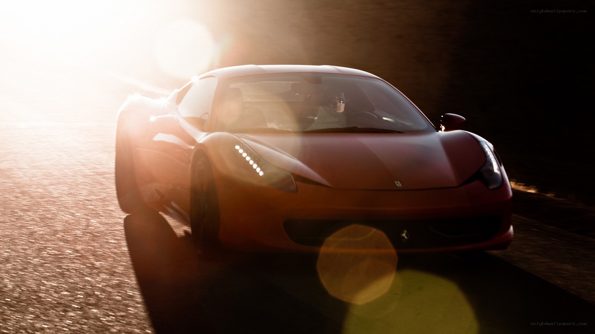 red ferrari at sunset