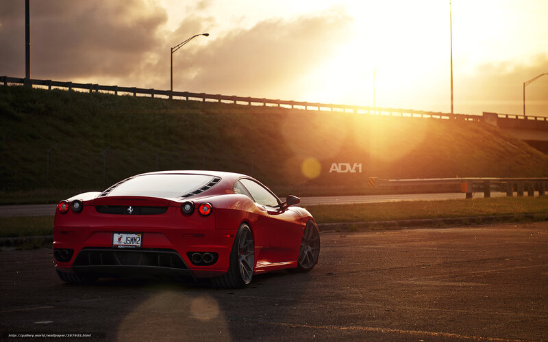Red Ferrari at sunset