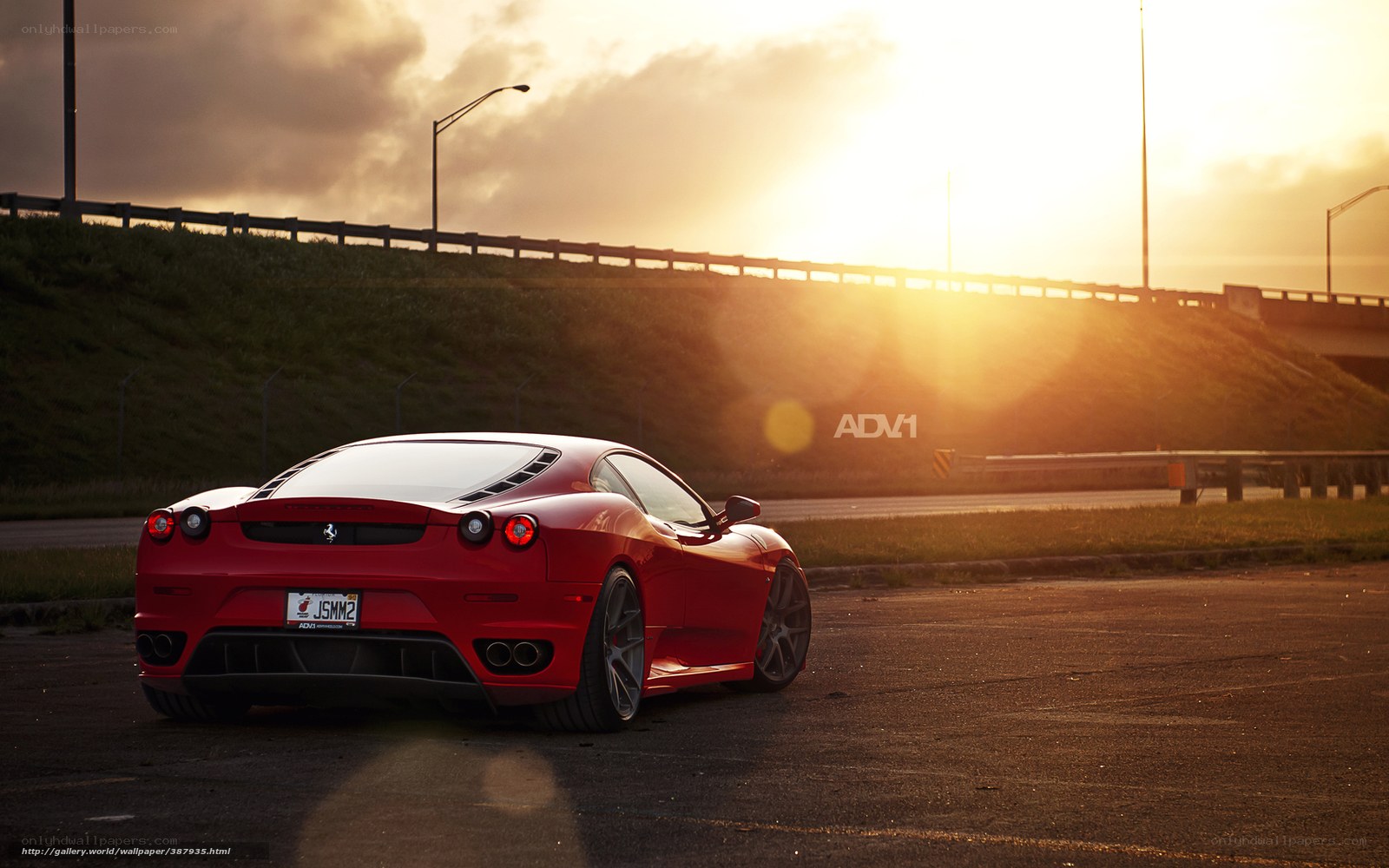 Red Ferrari at sunset