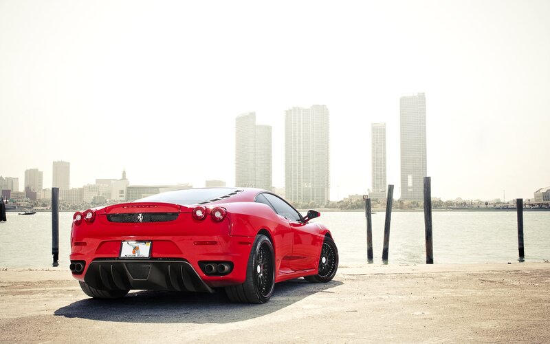 Red Ferrari by the water