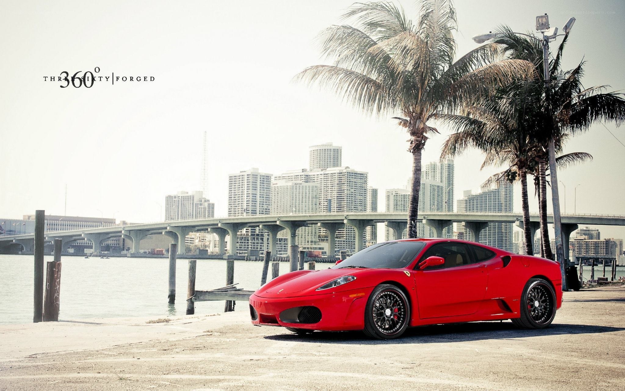 Red Ferrari by the water