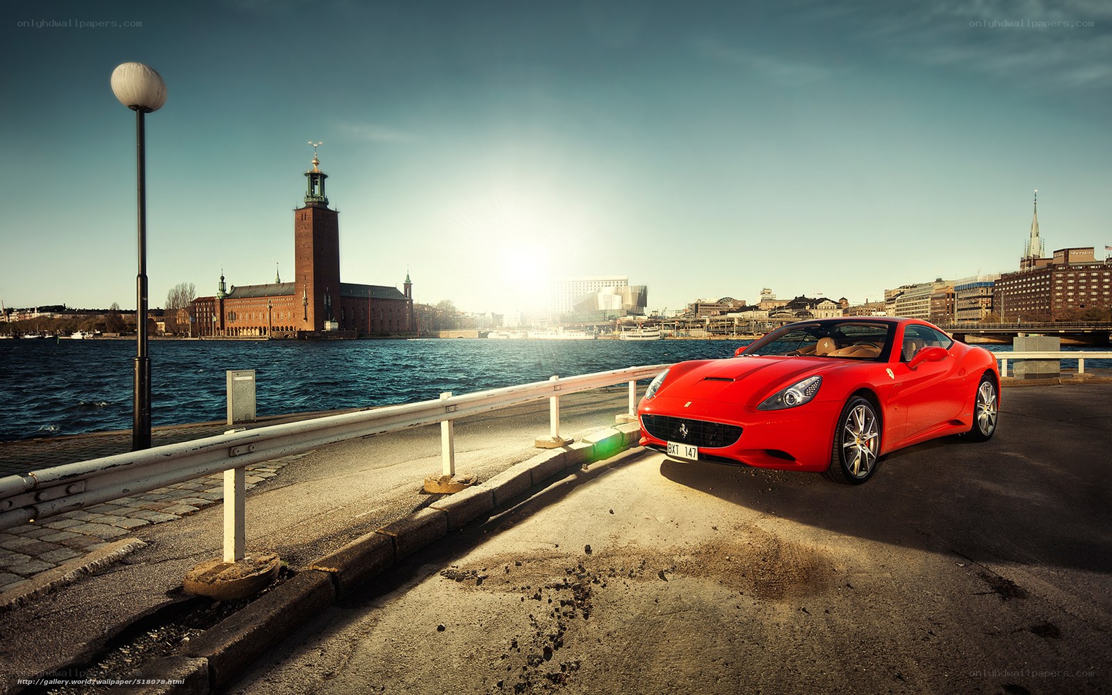 Red Ferrari by the waterfront