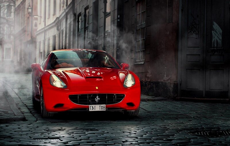 Red Ferrari Car — Dramatic, Photograph, Cobblestone Street, Buildings