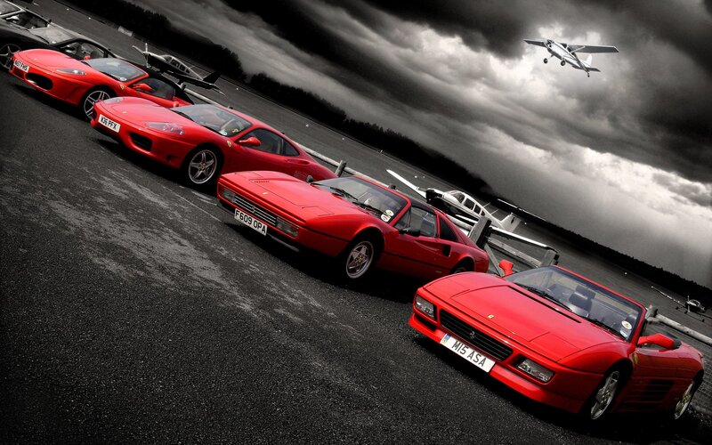 Red Ferrari Cars on Tarmac