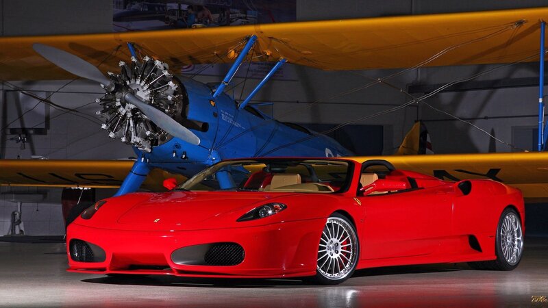 Red Ferrari Convertible — Dramatic, Photograph, Airplane