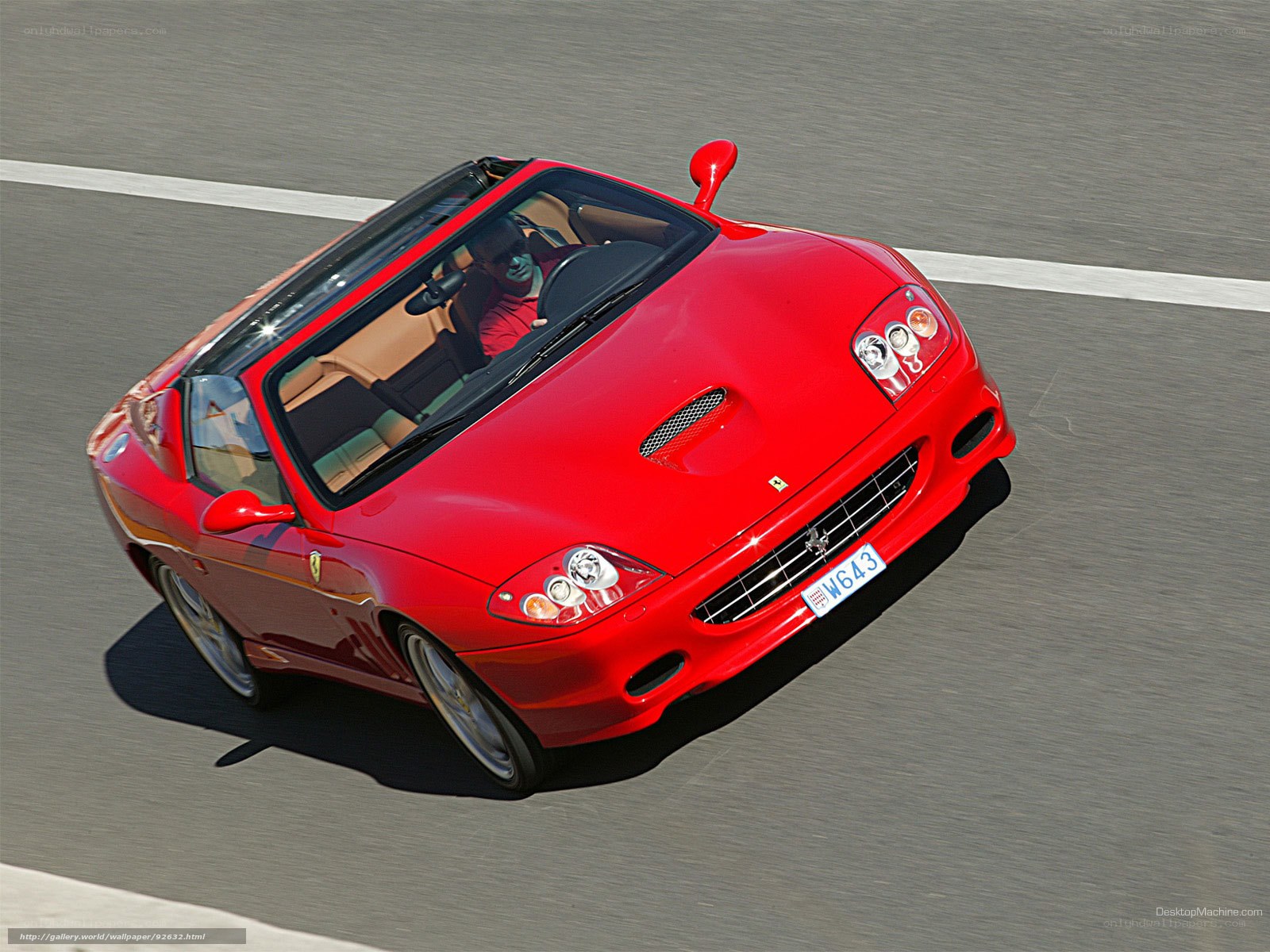 red ferrari convertible in motion