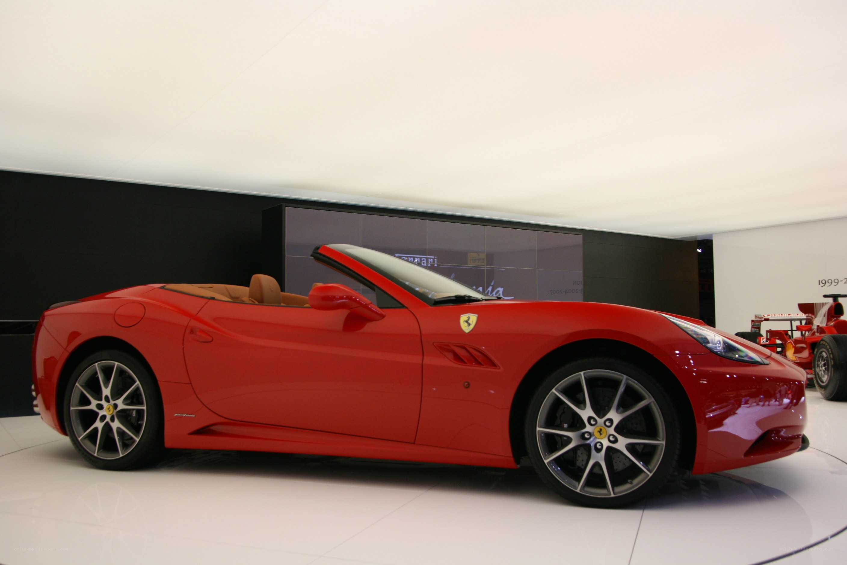 Red Ferrari convertible on display