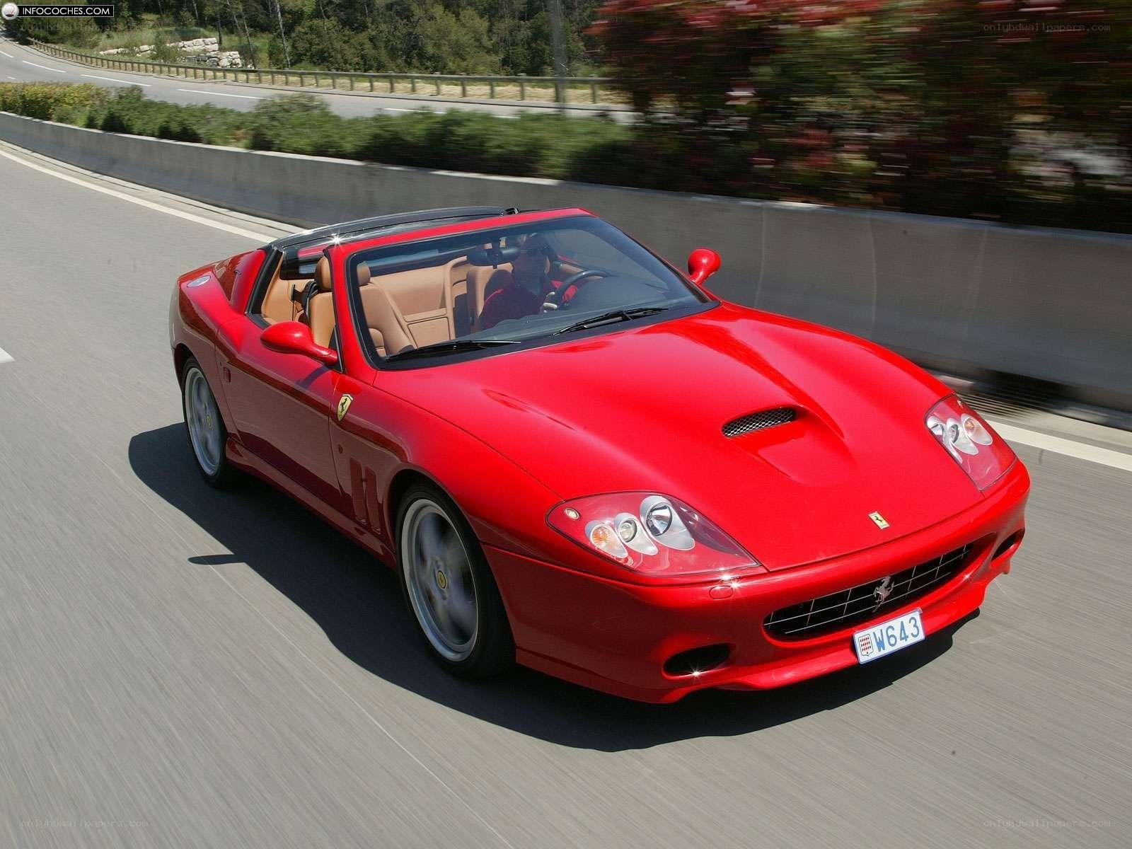 Red Ferrari convertible on road