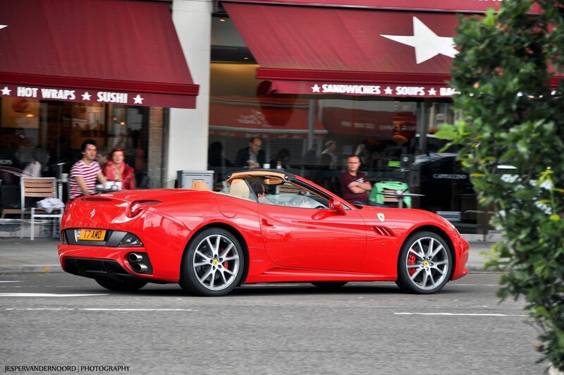Red Ferrari convertible on street