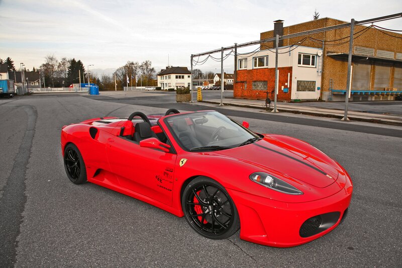 Red Ferrari convertible on street