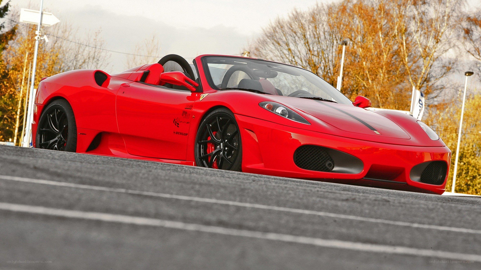 Red Ferrari convertible on track