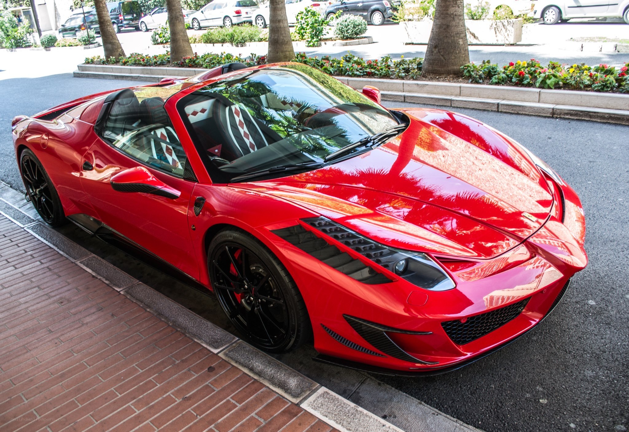 Red Ferrari convertible parked