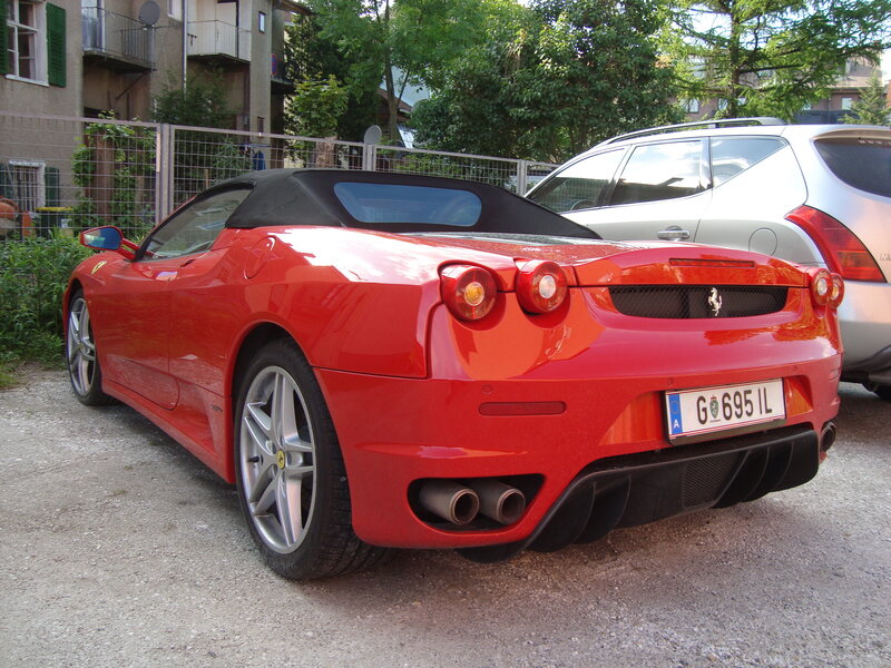 red ferrari convertible parked