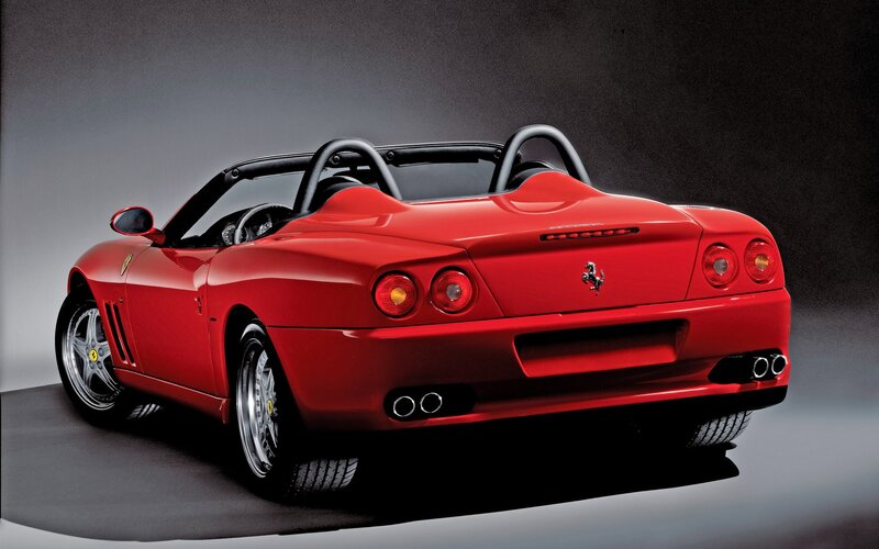 Red Ferrari convertible rear view
