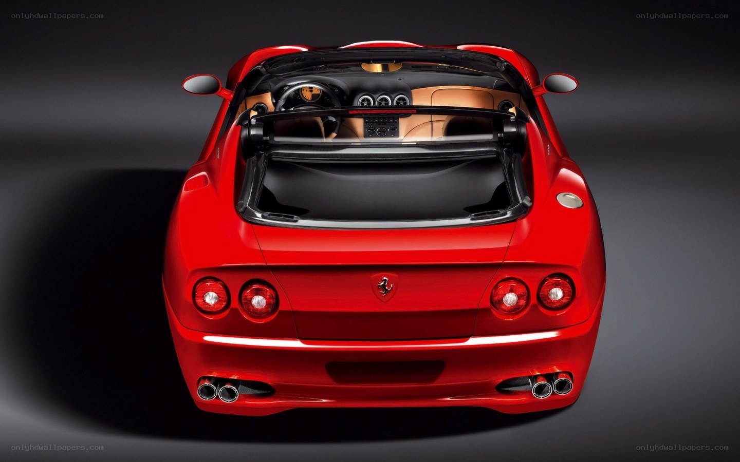 Red Ferrari convertible rear view