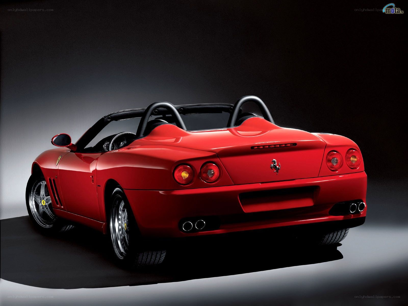 red ferrari convertible rear view