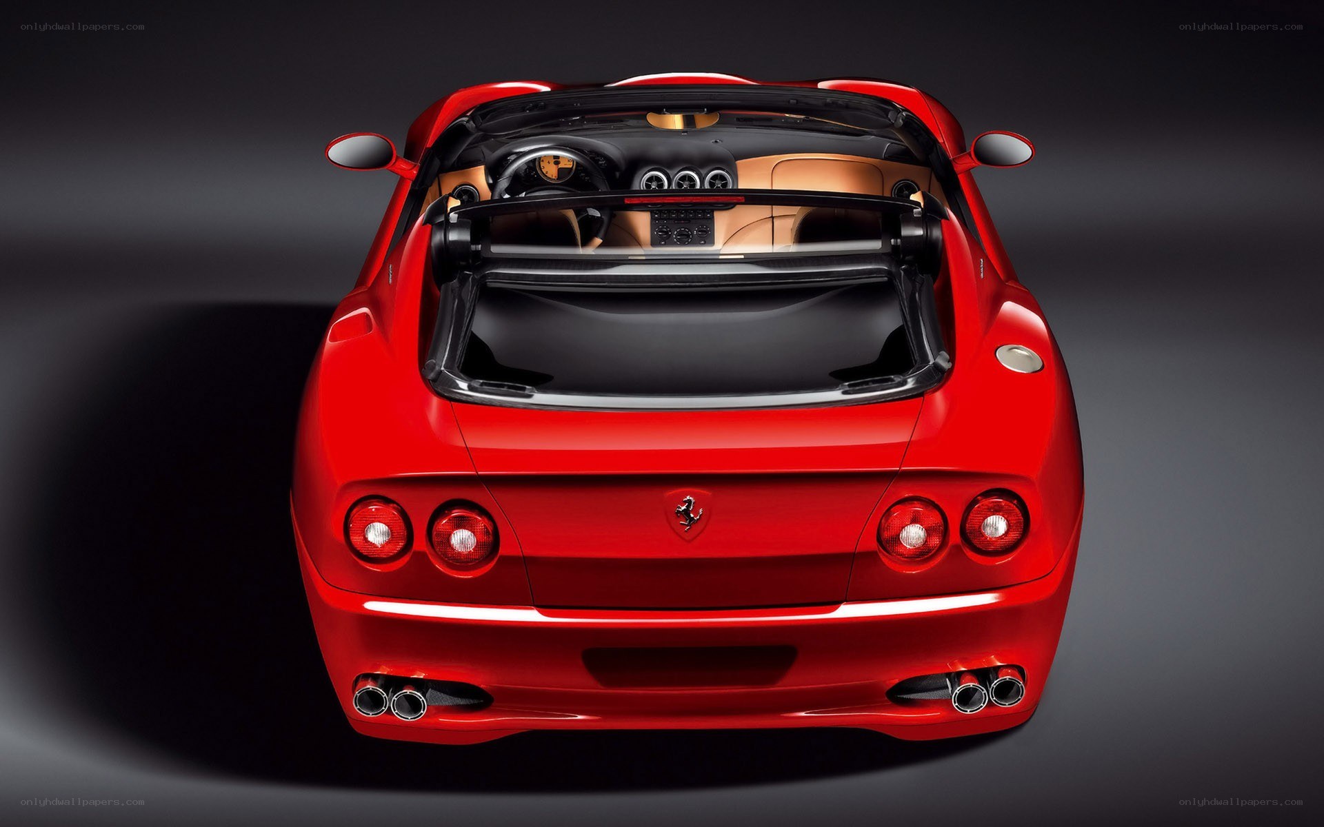 Red Ferrari convertible rear view