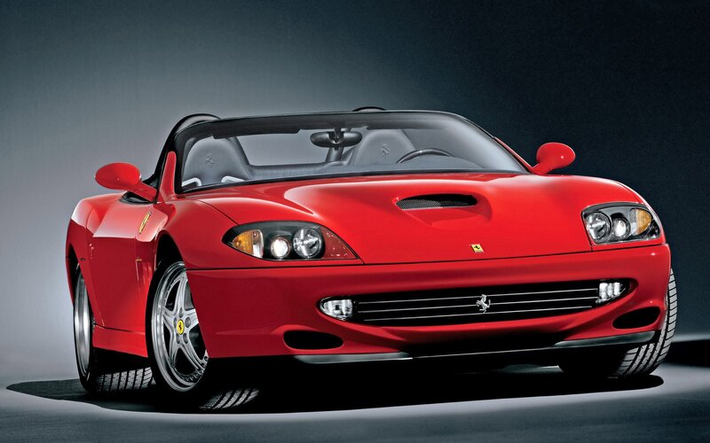 Red Ferrari convertible sports car