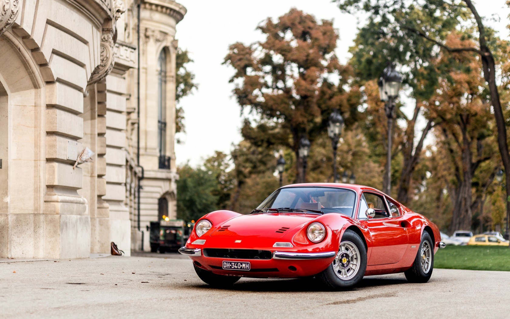 Red Ferrari Dino parked outside