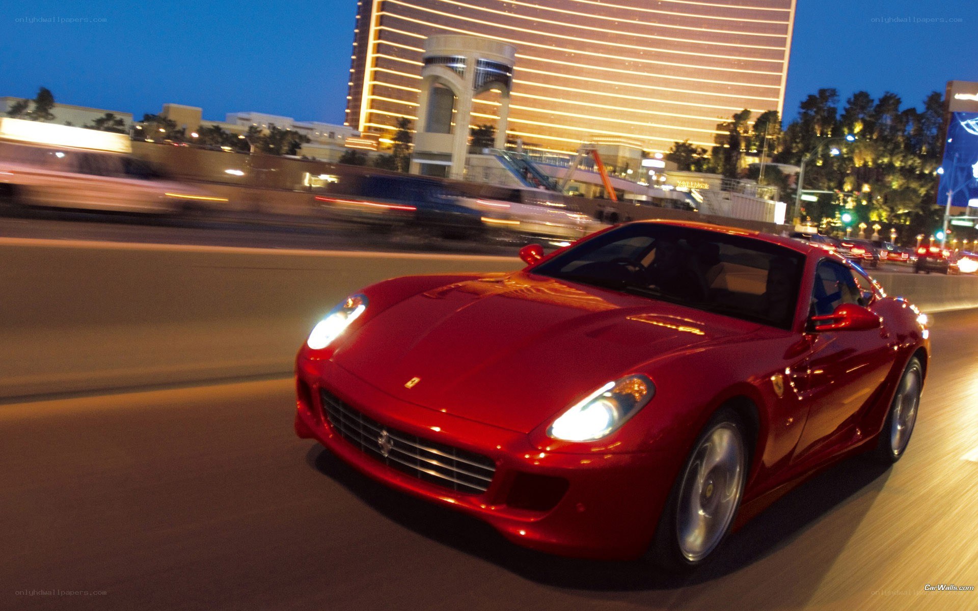 Red Ferrari driving at night