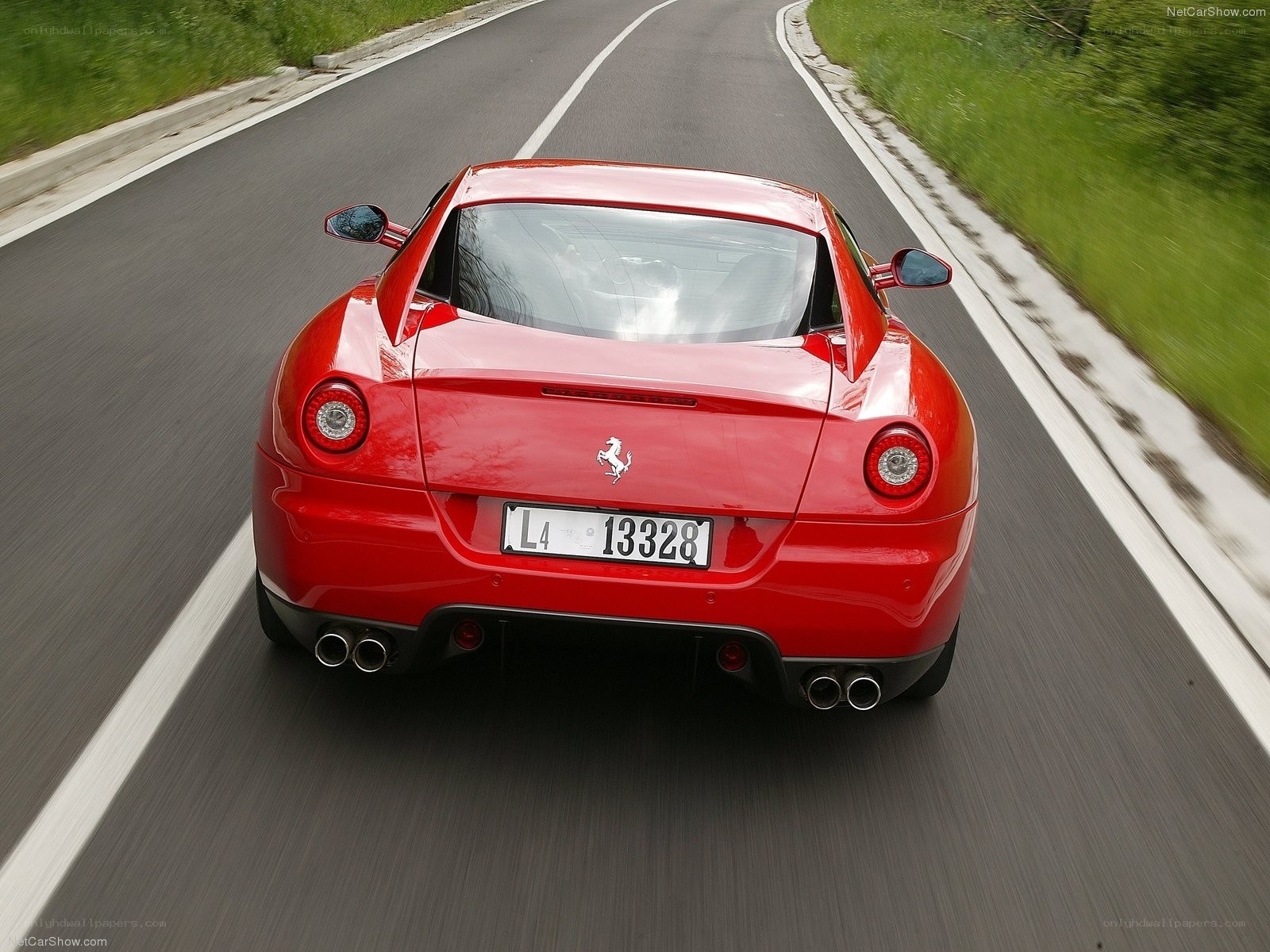 red ferrari driving on road