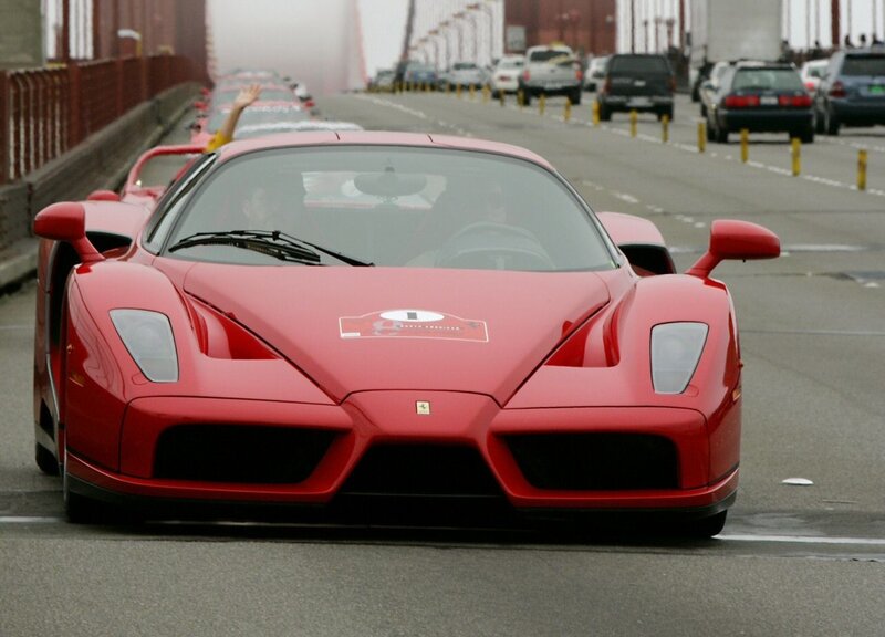 Red Ferrari Enzo on a bridge