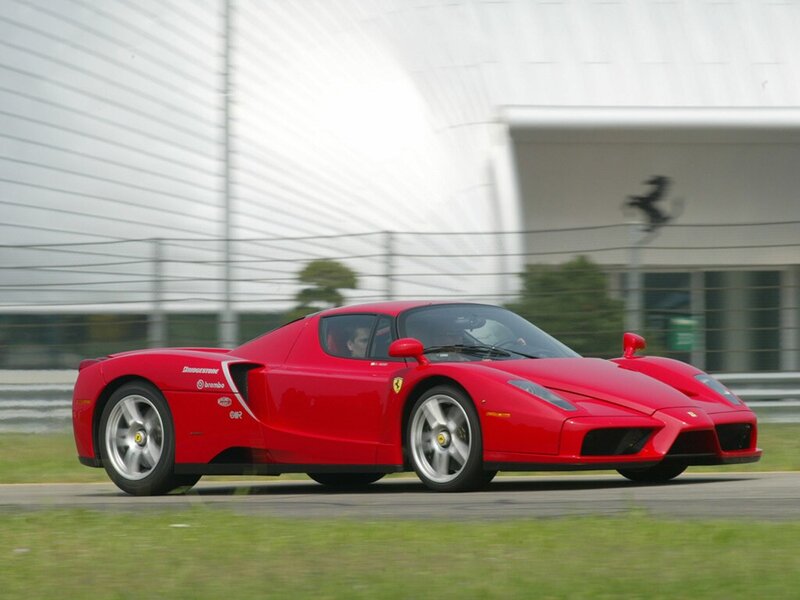 Red Ferrari Enzo on a racetrack
