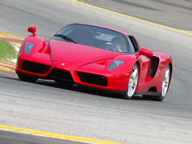 Red Ferrari Enzo on a racetrack