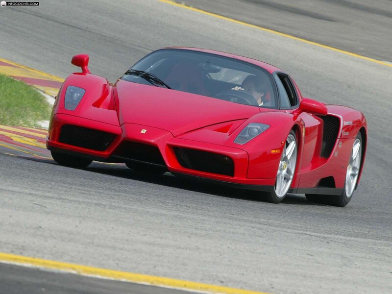 Red Ferrari Enzo on a racetrack
