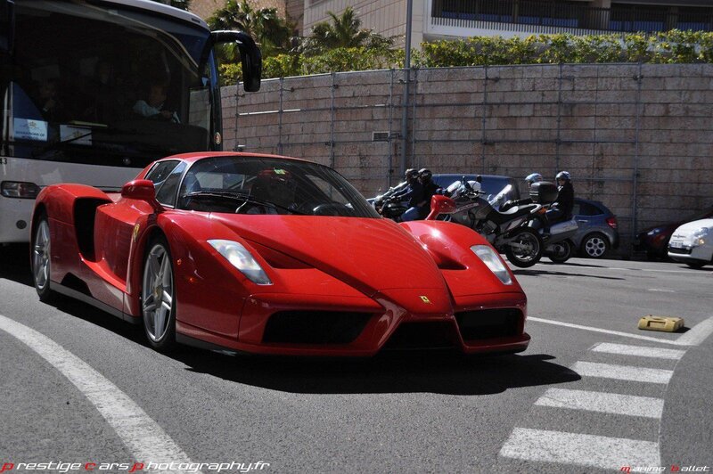 Red Ferrari Enzo on city street