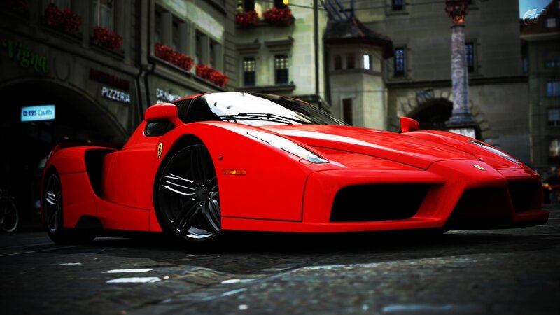 Red Ferrari Enzo on city street