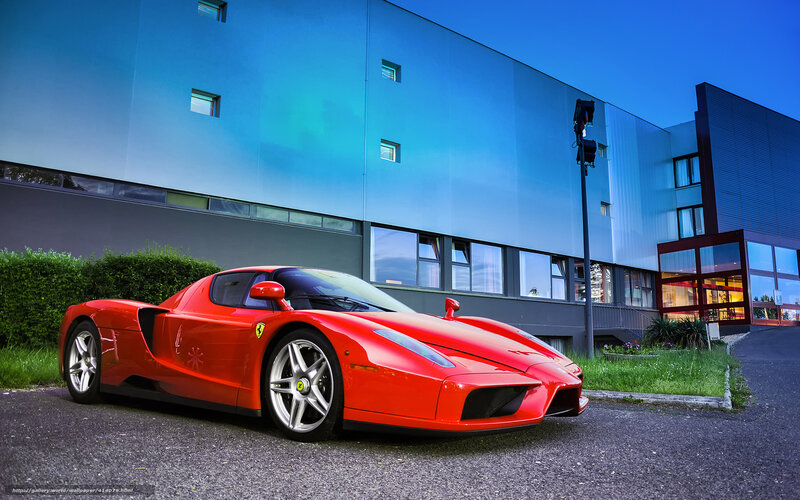 Red Ferrari Enzo parked outside