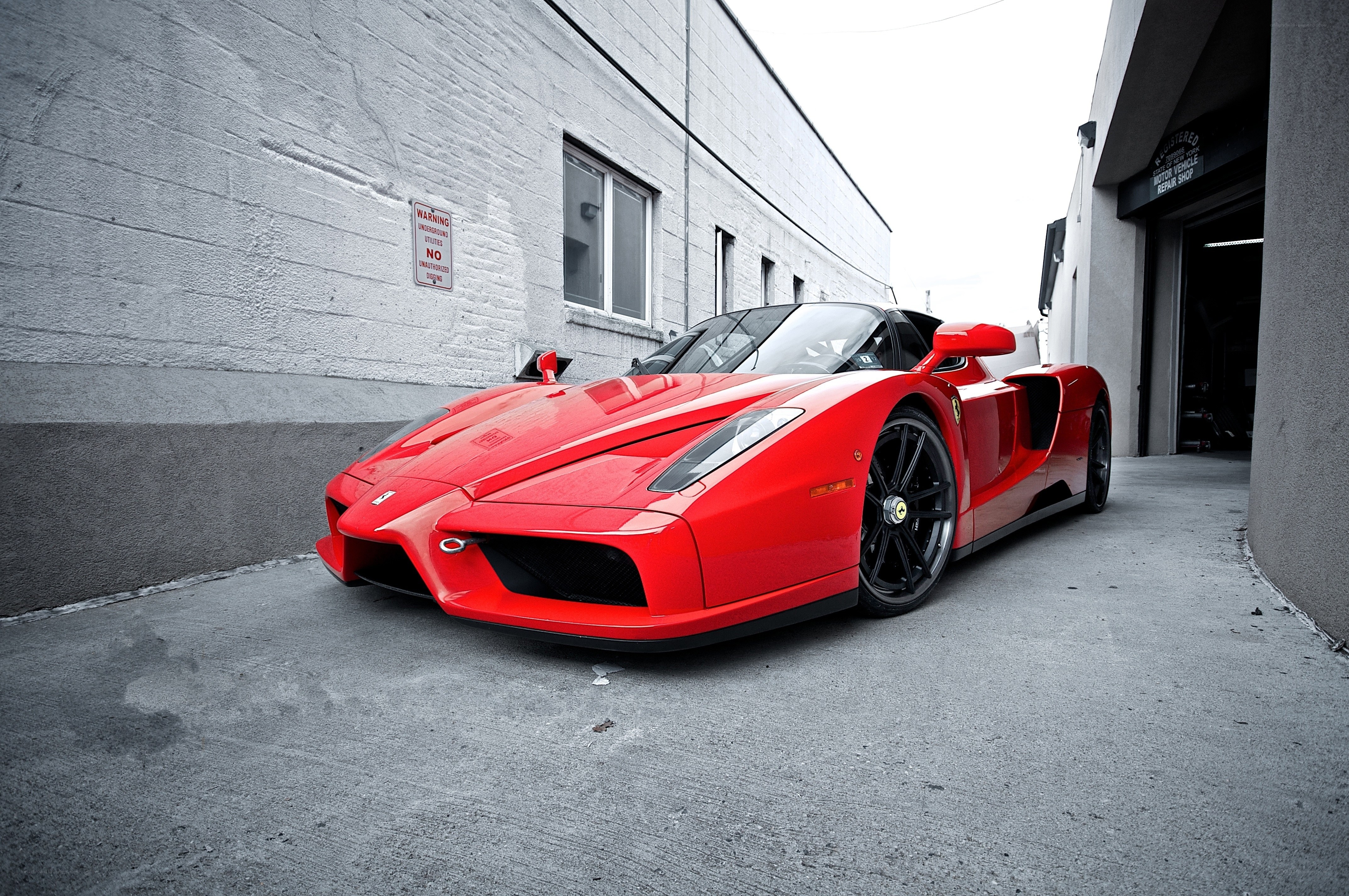 red ferrari enzo parked