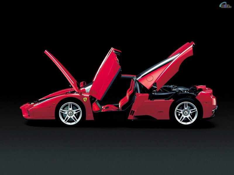 Red Ferrari Enzo with doors open