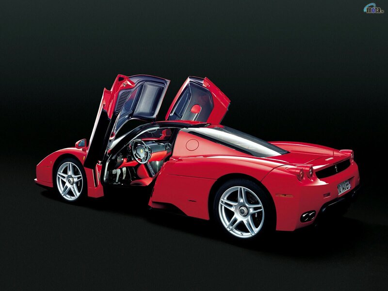 Red Ferrari Enzo with doors open