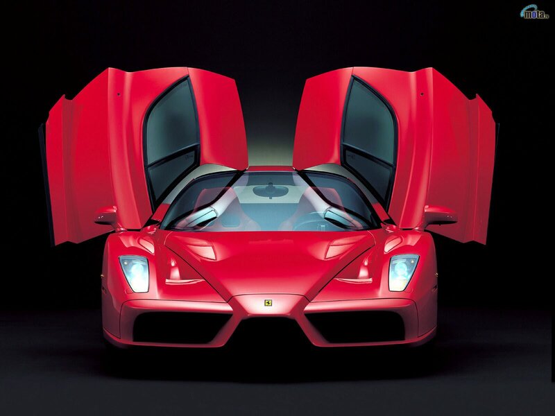 Red Ferrari Enzo with doors open