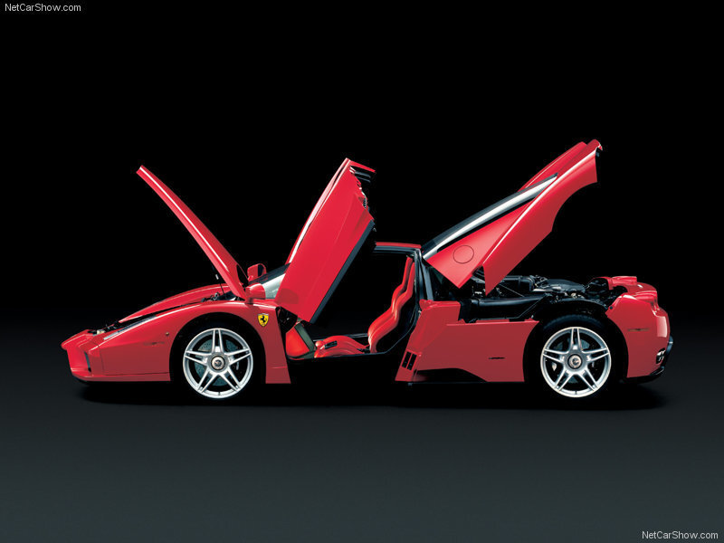 Red Ferrari Enzo with doors open