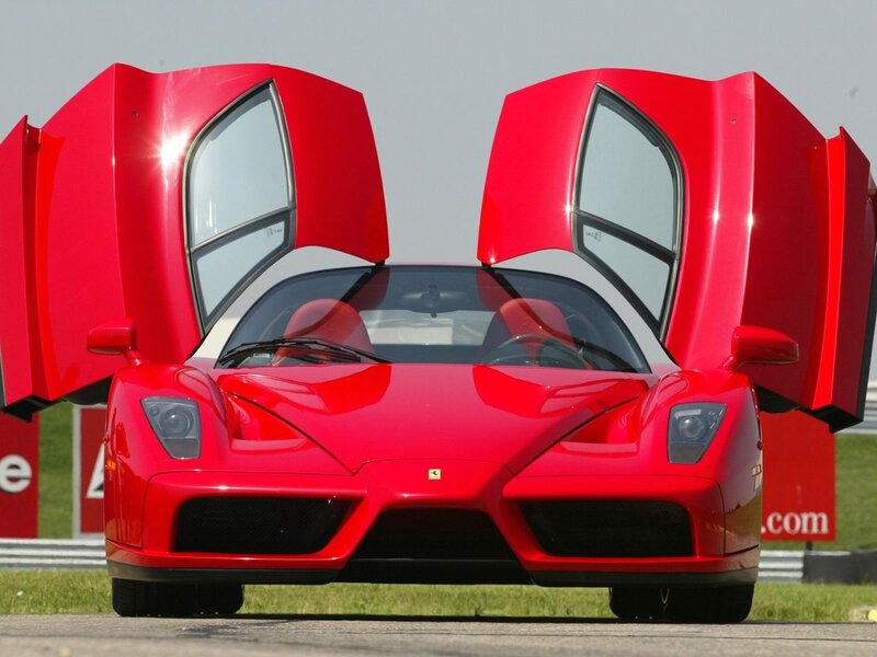 Red Ferrari Enzo with doors open