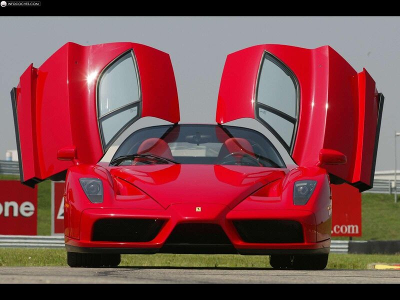 Red Ferrari Enzo with doors open