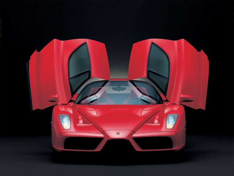 Red Ferrari Enzo with doors open