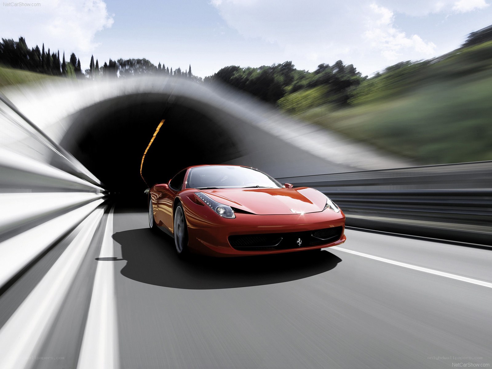 Red Ferrari exiting tunnel