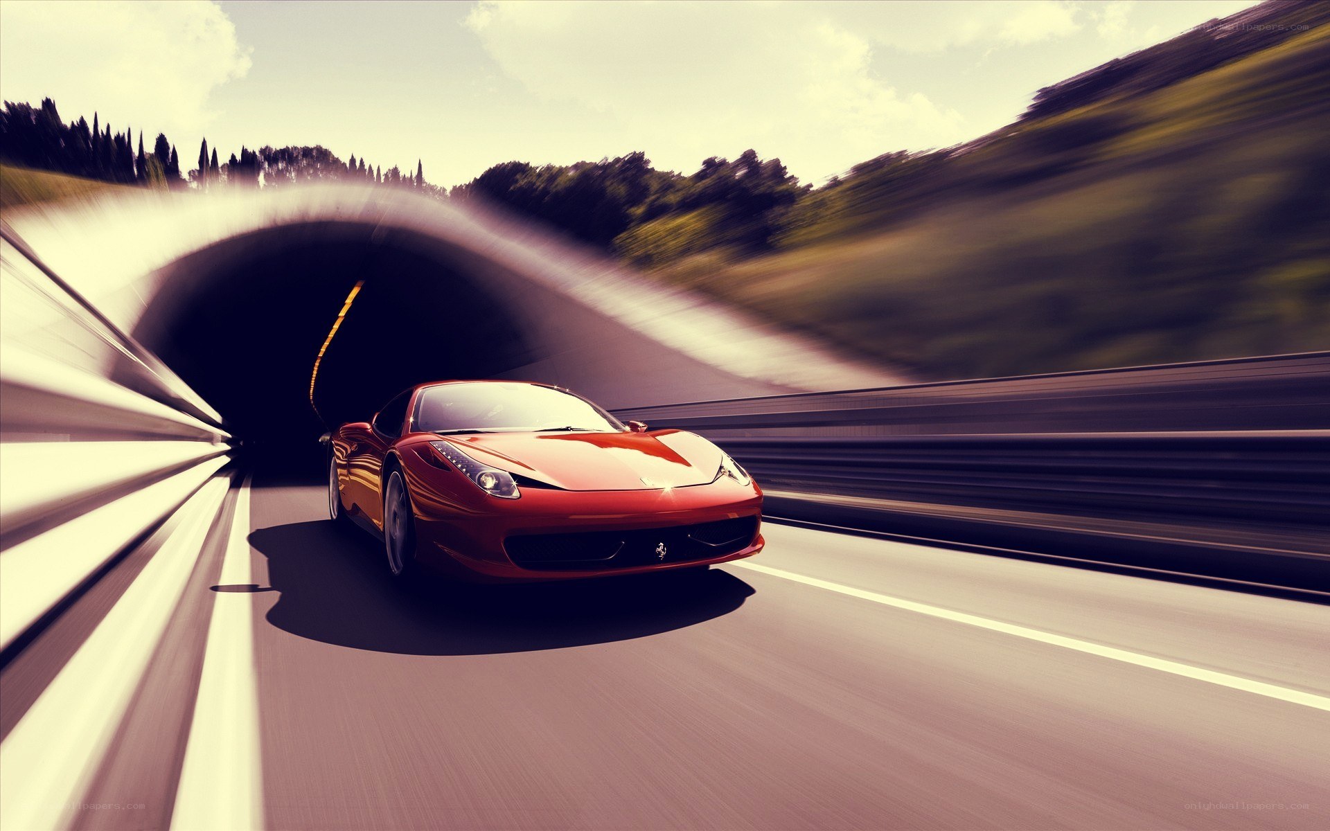 Red Ferrari exiting tunnel